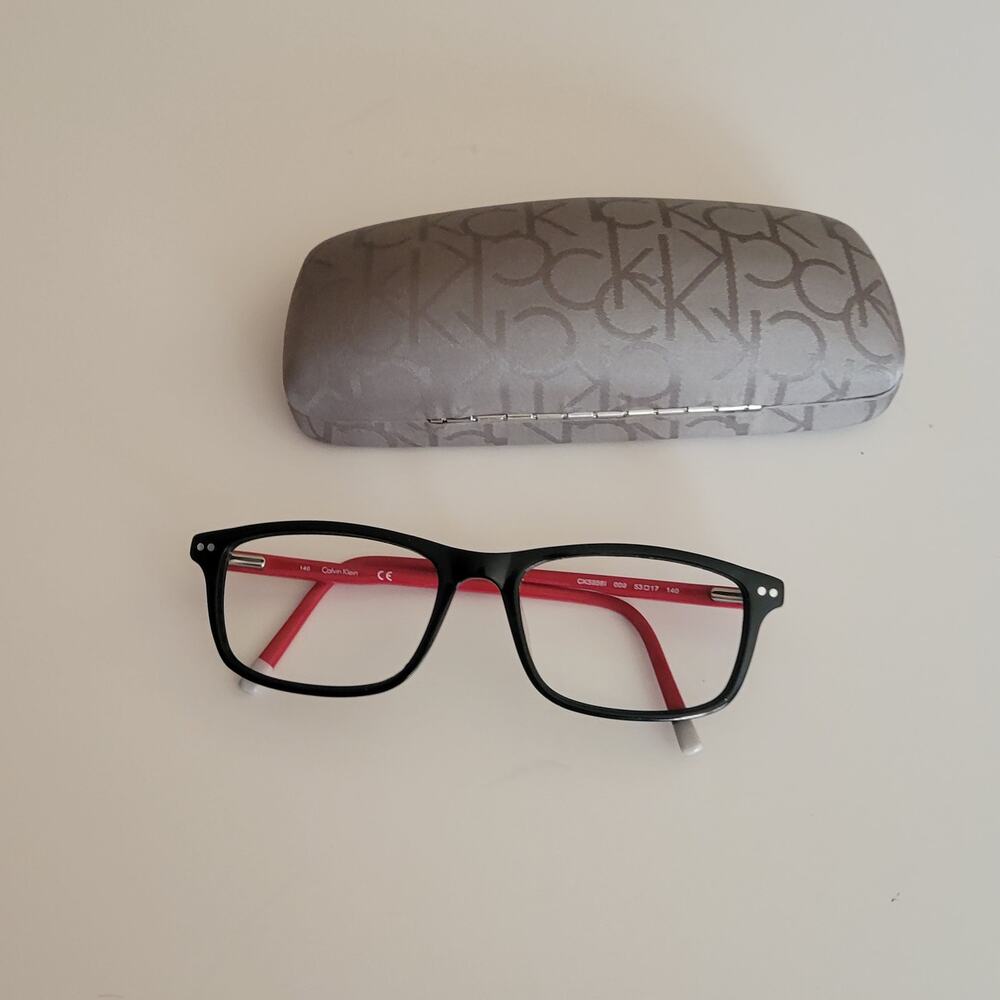 Calvin Klein CK59561 model featuring a black and red frame design 53X17X140